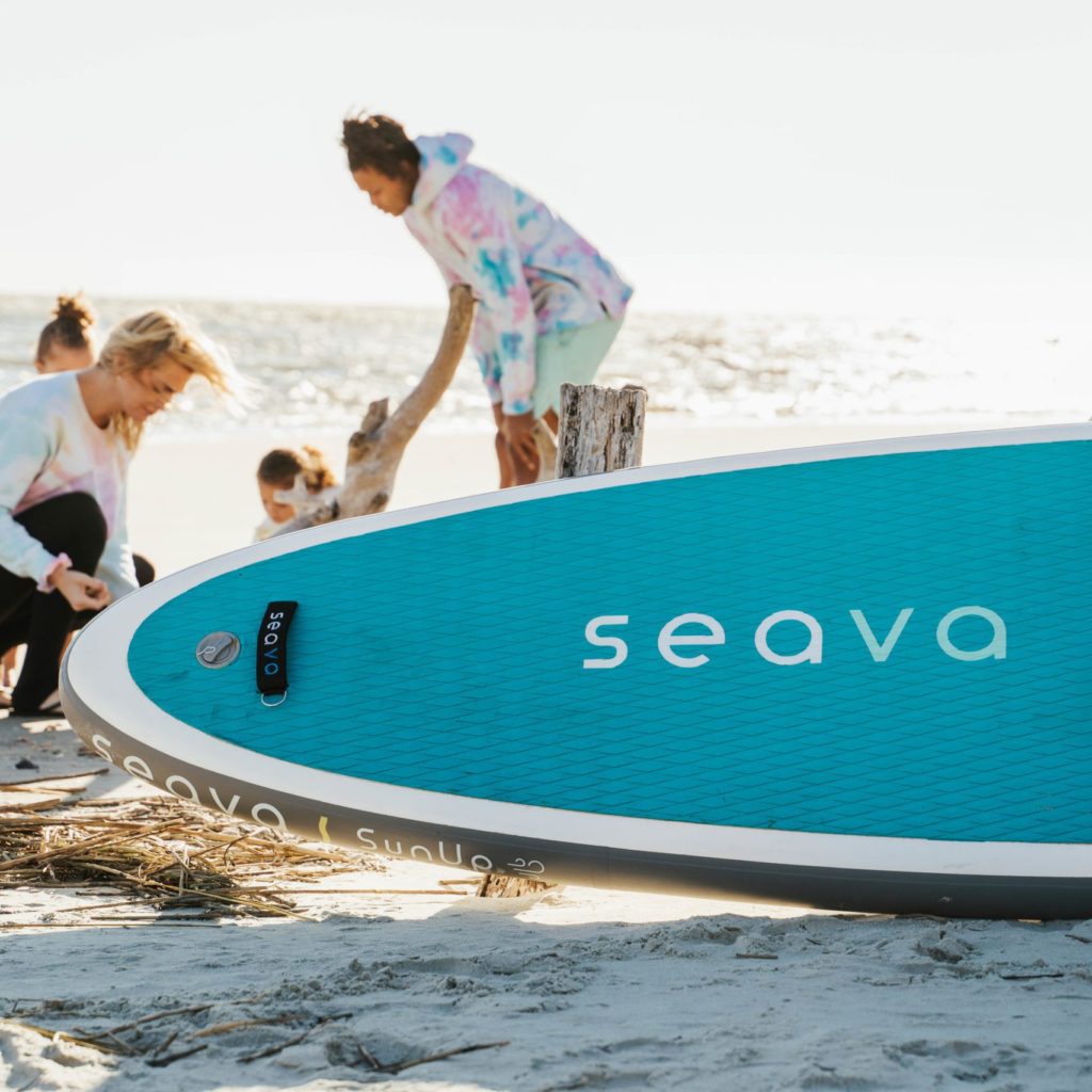 Family on beach with SeaVa paddleboards